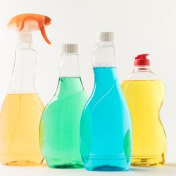 98753341-close-up-view-of-plastic-bottles-with-colorful-cleaning-fluids-isolated-on-white