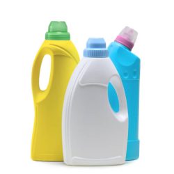 Household cleaning products in plastic bottles isolated on a white background. Colorful plastic bottles product mockup.